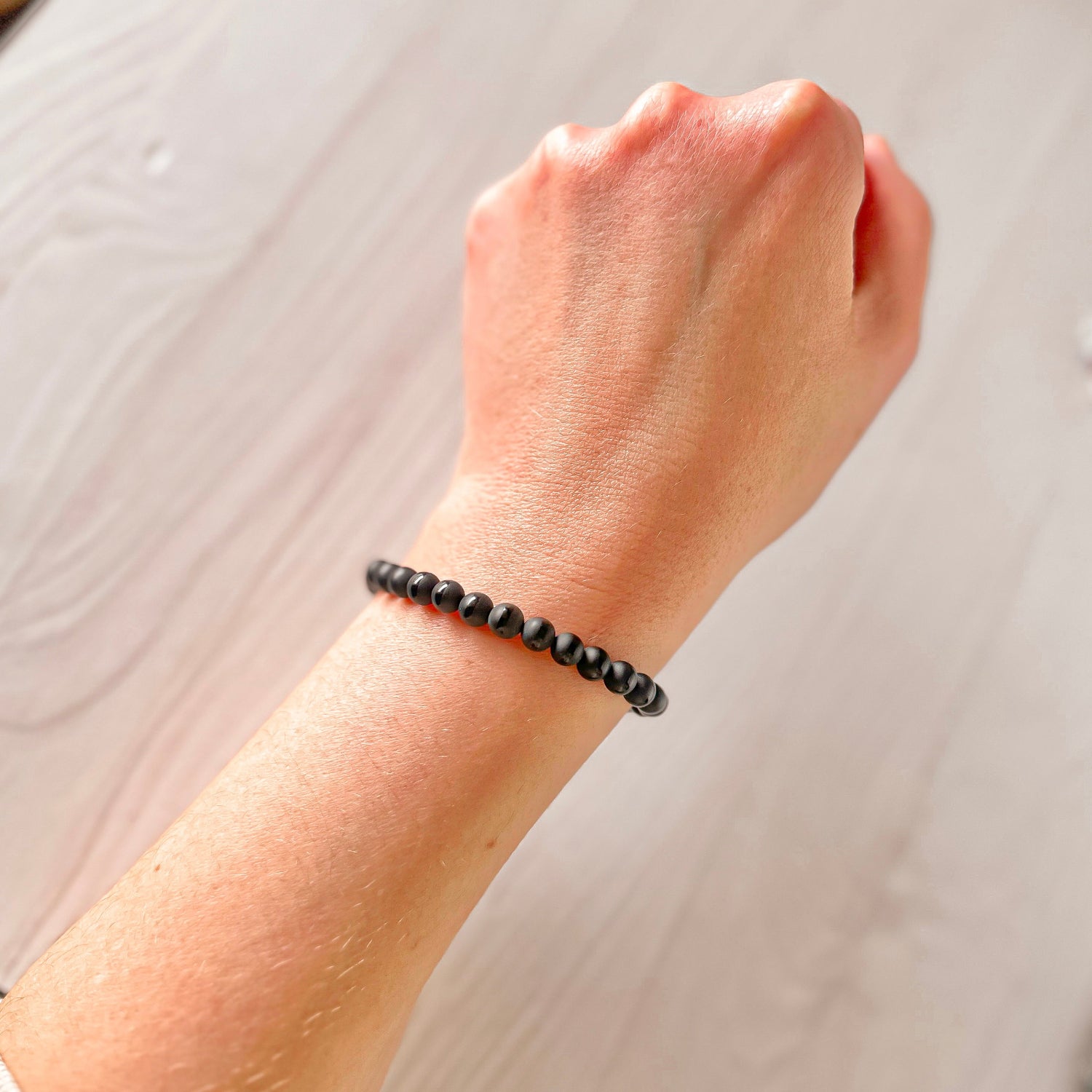 mini stacker bracelet from featherly in black onyx matte striped