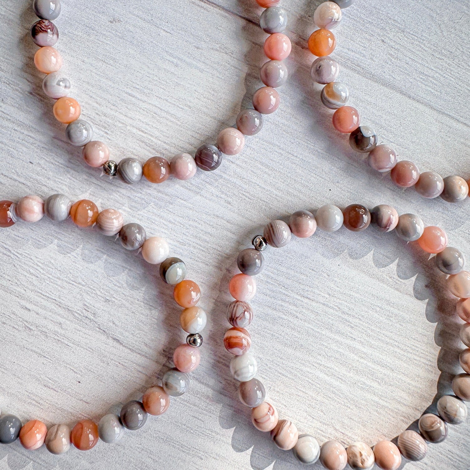 pink, gray, and coral beaded bracelet for women