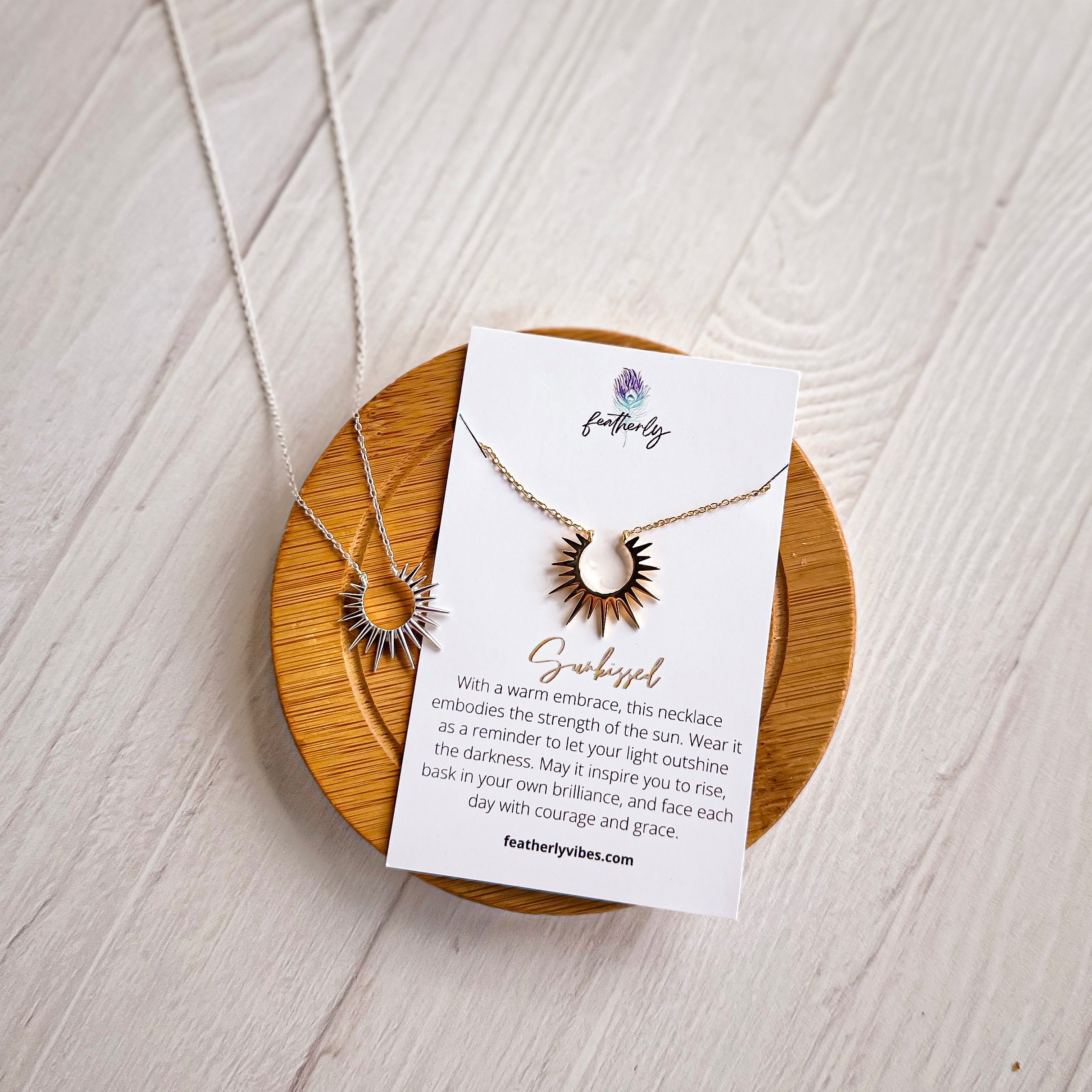 sunburst sterling silver and gold sun necklace on meaning card from Featherly