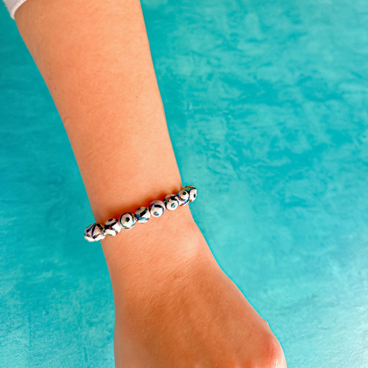 stacker bracelet from featherly in black evil eye tibetan agate