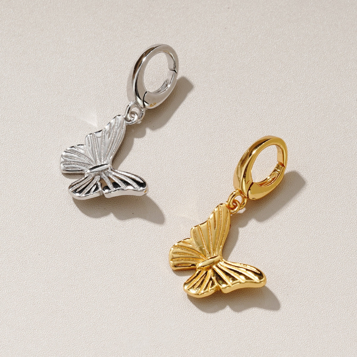 butterfly charms in silver and gold for bracelets and chain necklaces that clip on from Featherly