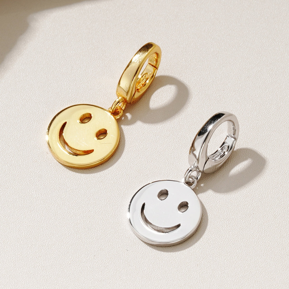 Featherly Smiley face charms for bracelets or necklace chains in gold and sterling silver that clip on