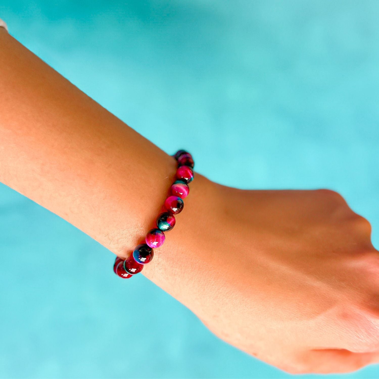 stacker bracelet from featherly in fuchsia galaxy tiger's eye