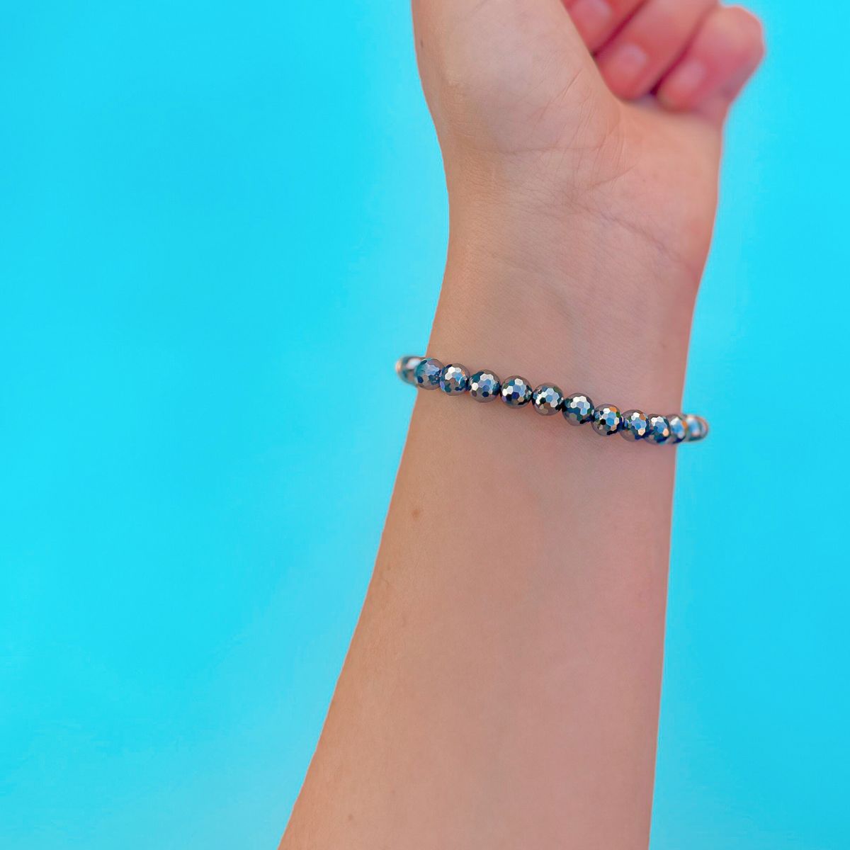mini stacker bracelet from featherly in terahertz