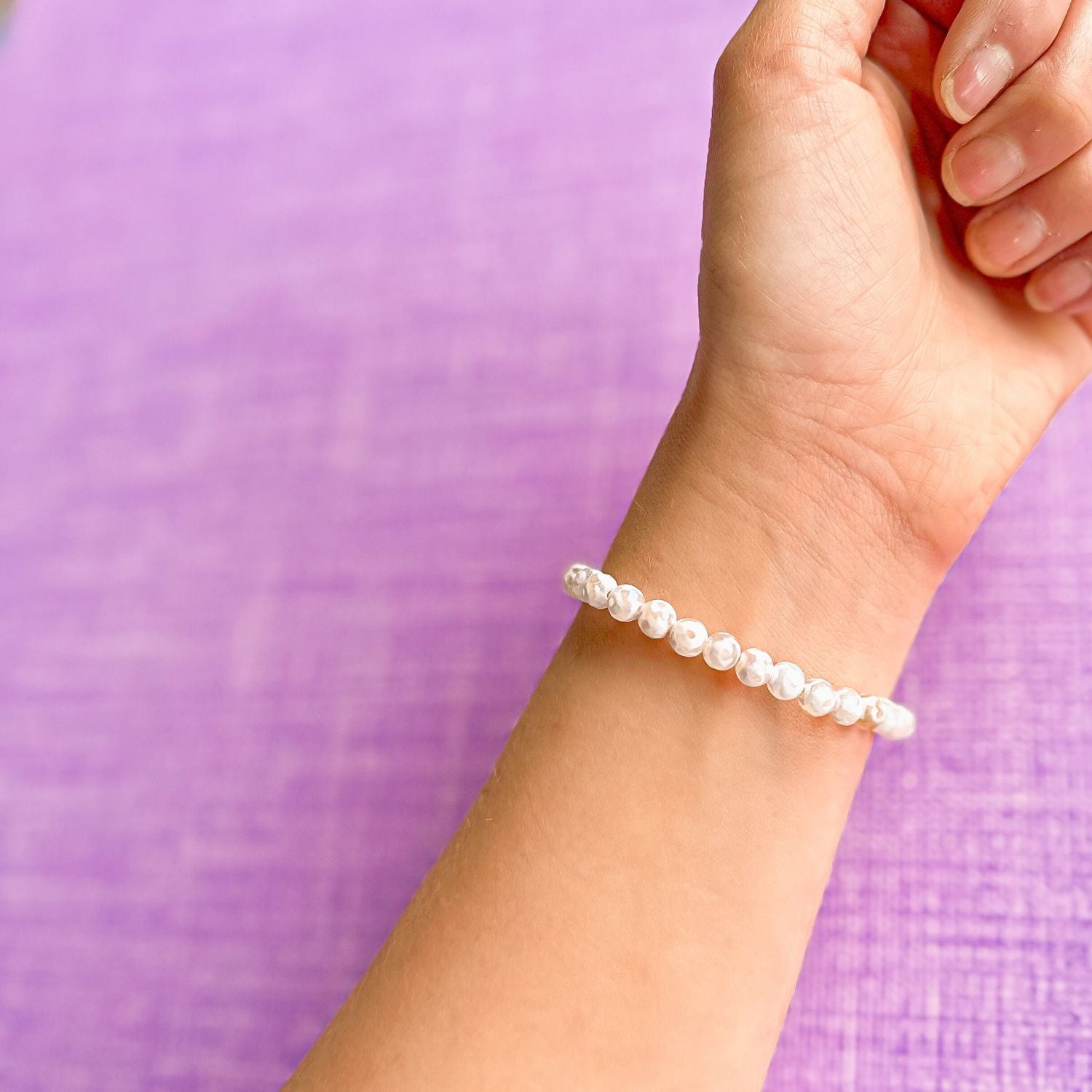 mini stacker bracelet from featherly in white evil eye tibetan agate