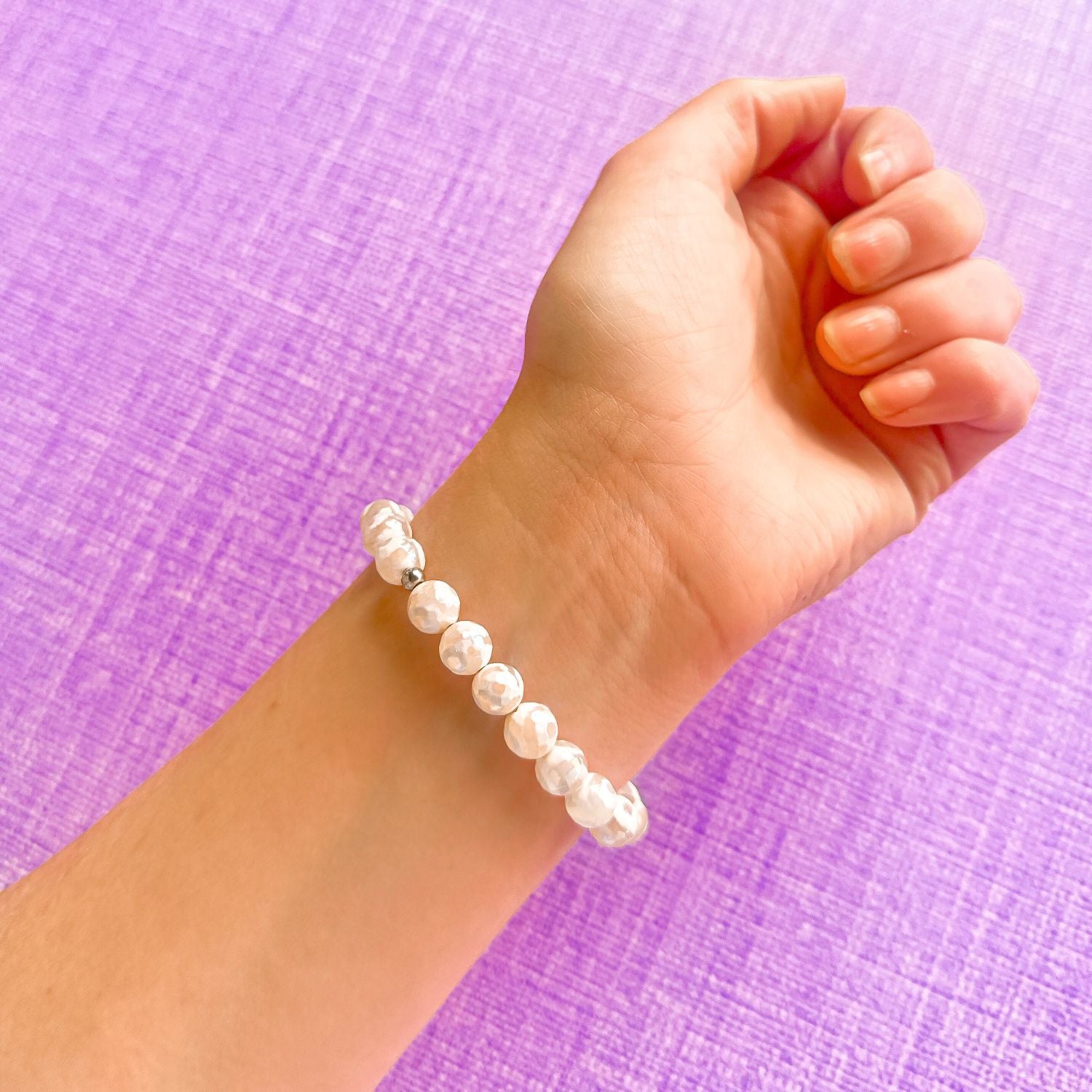stacker bracelet from featherly in white evil eye tibetan agate