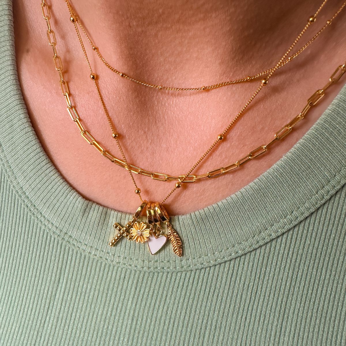 necklace charms gold from featherly layered on dainty chain layered with satellite chain and paperclip chain
