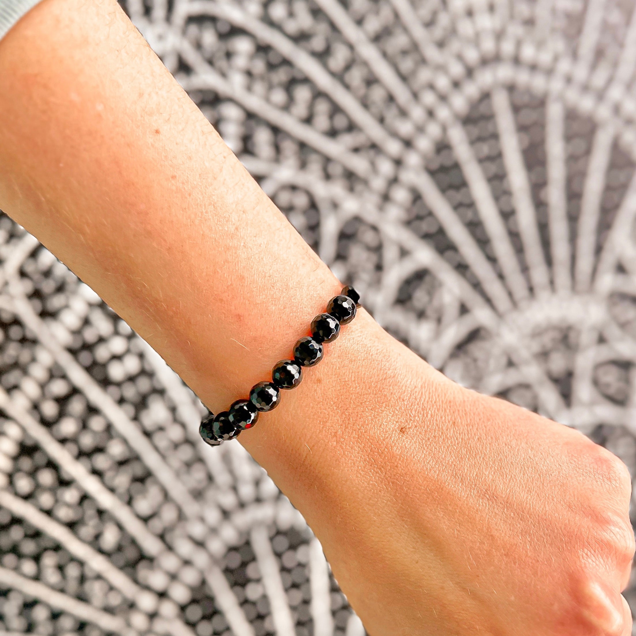 Featherly Black Onyx Faceted Stacker Crystal Gemstone Beaded Bracelet on wrist