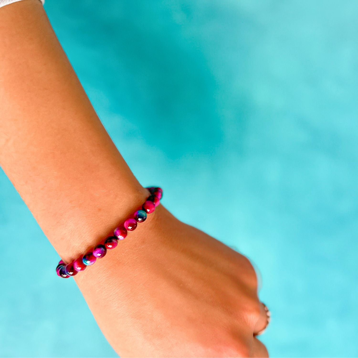 mini stacker bracelet from featherly in fuchsia galaxy tiger's eye 