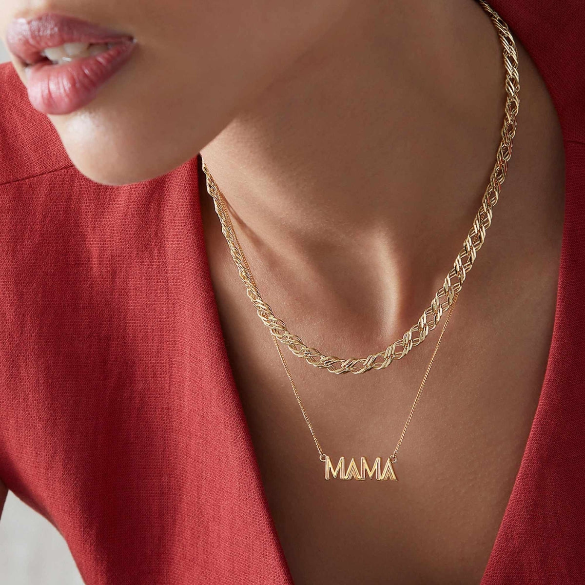 Featherly gold mama necklace on model layered with gold chain necklace