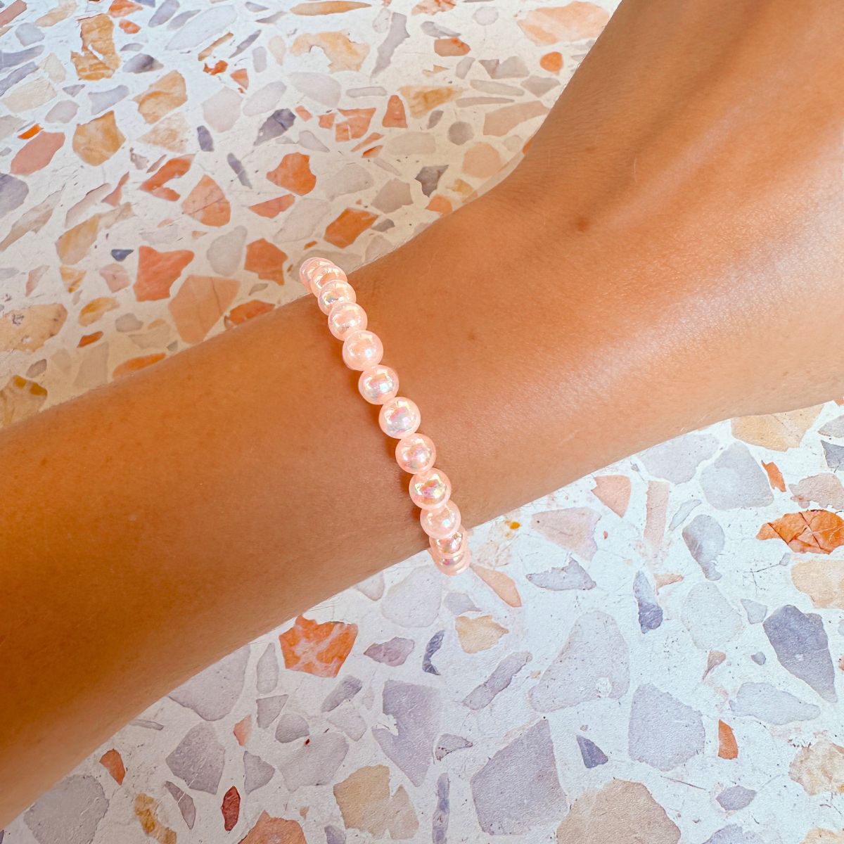 mini stacker bracelet from featherly in mystic peach selenite