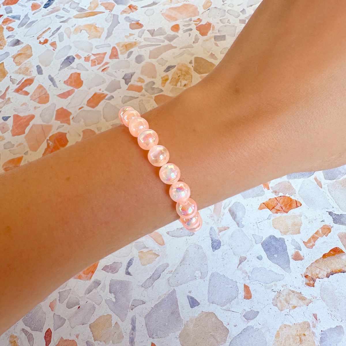 stacker bracelet from featherly in mystic peach selenite