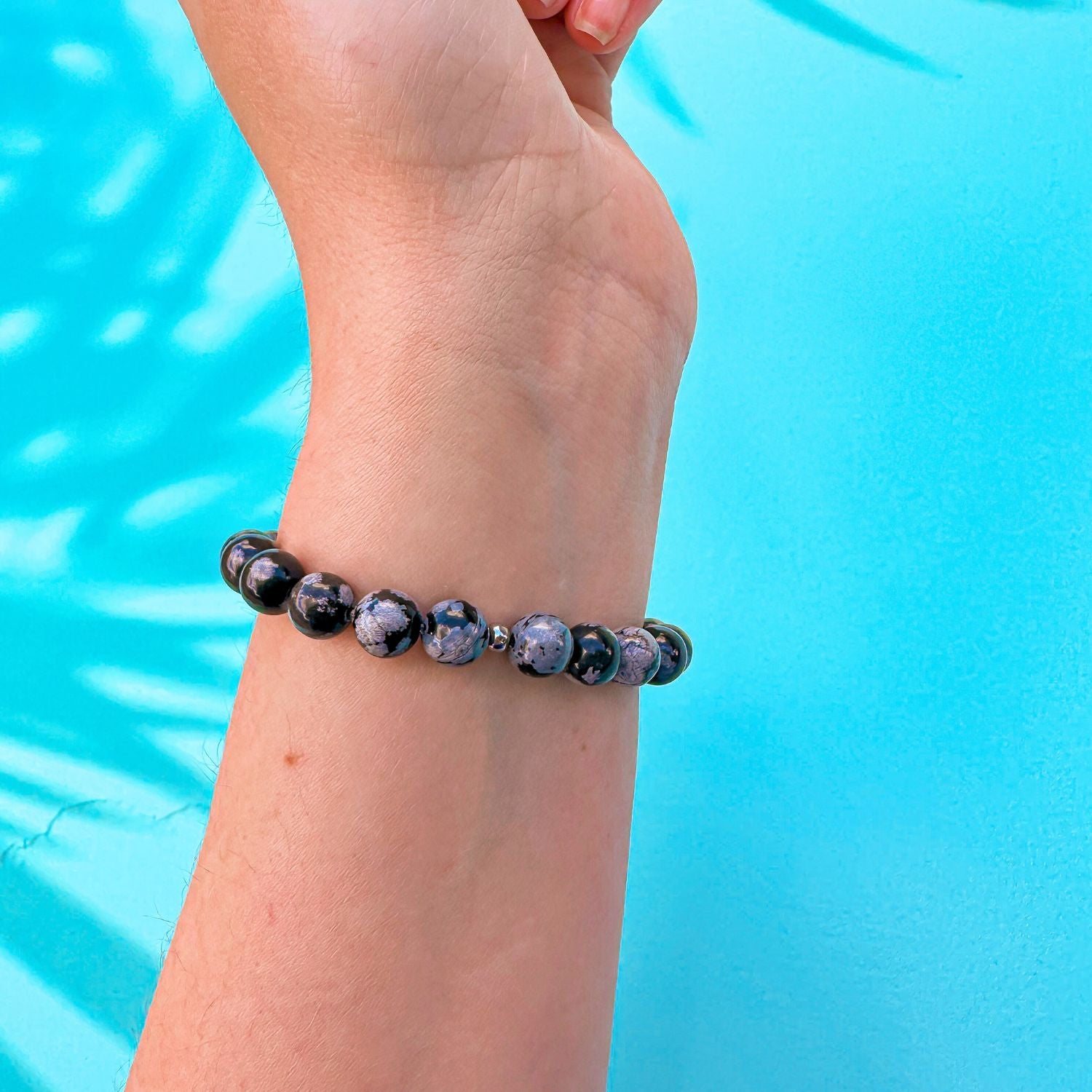 stacker bracelet from featherly in snowflake obsidian