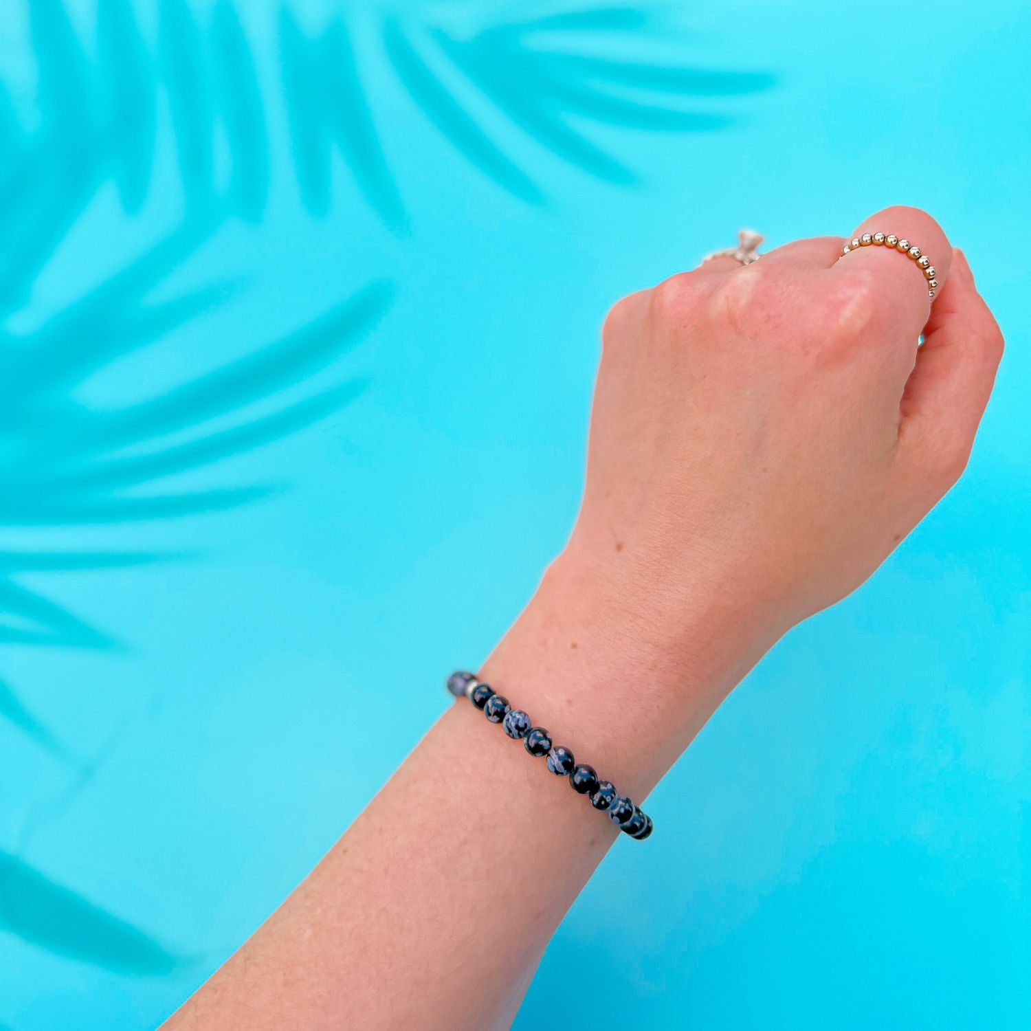 mini stacker bracelet from featherly in snowflake obsidian